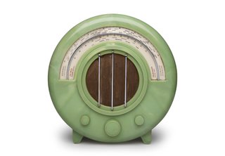 Ekco AD65 Radio Wells Coates designed the AD65 radio, shown here in a rare green version, for British electronics company Ekco in 1932. New technology made this wireless device possible, but it was the visual shift from wood cabinetry-like casing that made the piece stand out. 