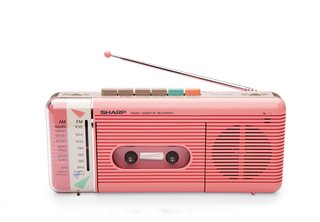 QT-50 Cassette Recorder This portable tape player and recorder by William Lansing Plum for Sharp, released in 1985, also played AM/FM radio. The colorful pastel shell and control buttons nodded to an emerging—and enduring—trend: electronics as personal fashion accessory.