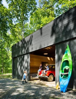 A Dwell Favorite: Relaxing Along the River - Photo 2 of 3 - The spacious detached garage stows a bevy of kayaks and inner tubes, not to mention the family car. 
