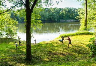 A Dwell Favorite: Relaxing Along the River - Photo 3 of 3 - Sited on a long and narrow 40-acre plot, the home opens to expansive views of the river, to the north—and plenty of space for the kids to play.