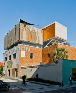 Fiberglass composite louvers, which Rich can control from the deck, block out views from a nearby college dorm and parking garage. 