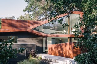 50 Modern Homes With Floor-to-Ceiling Windows - Photo 19 of 50 - Resident Richard Kim, who works as the head of design at electric car company Faraday Future, tested his know-how with the creation of his own Los Angeles home, a curvilinear structure clad in Cor-Ten steel and black-stained cedar. "This house is different," says Richard. "It’s as much a sculpture as it is a place to live."