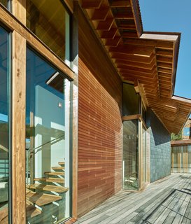 A Tekmar system distributes solar-collected heat throughout the compound. Wells designed the buildings to carefully respond to the roof pitch of both the original architecture and the neighboring homes.