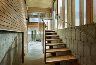 The structures, connected by sheltered walkways, frame a grassy courtyard. "Compositionally, I was trying to create bookends to the clubhouse." Wells says. "I looked at all the parts in assembly."
