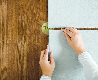Ditch the Area Rug: This Easy, Modular Carpet System Has Serious Green Cred - Photo 4 of 6 - Installation of FLOR carpets is made simple with non-toxic adhesive dots that stick to the bottom of the carpet squares. The pieces only stick to each other, not the floor, so it's easy to remove, rearrange, and transport the rug.