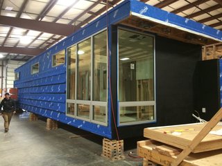 On the other side, windows wrap around the corner, letting natural light stream into the space.