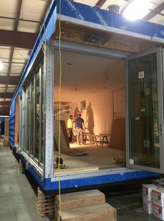 The unit will also feature a freestanding outdoor kitchen area with stainless steel cabinetry, a built-in refrigerator, and a barbecue