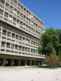 Unité d'Habitation de Marseilles is an example of the brise-soleil used by Le Corbusier. By setting the windows in a recessed grid, the building reduces heat gain. The colors indicate different apartment units. 