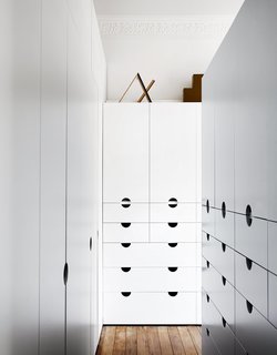 When an existing living room was transformed into a master suite, Nest tapped Mason Cabinets to create a bespoke dressing area.