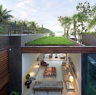 "Condomínio Baleia by Studio Arthur Casas in Sao Paolo, Brazil features a grass roof terrace with seaviews of Praia da Baleia beach."
