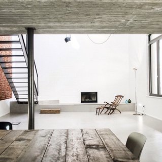 "UV House project in Varese, Italy, for a young couple—an industrial building converted to a modern urban sanctuary by OASI Architects."