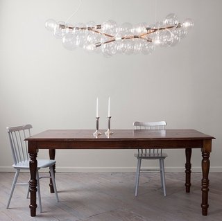 "Long bubble chandelier by Pelle Designs is a line of delicate and airy compositions of luminous glass globe clusters (2008)."