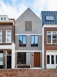 By setting an Amsterdam house a few feet back from the street, 31/44 Architects ensured the city’s planning department that the new construction would not block light to the surrounding structures. The gray brick facade references the building material of choice in the formerly industrial neighborhood, which has seen a residential resurgence.