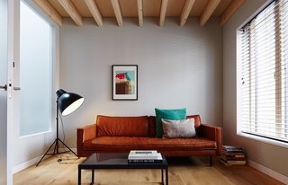 The Bank Slimm sofa by local furniture purveyor Loods 5 is paired with pieces sourced from British retailers Made and Habitat in the second-floor living room. 