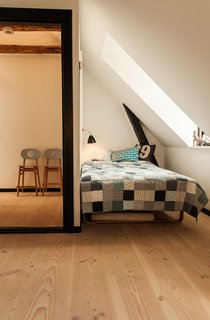 Mia had the uninsulated attic finished, but kept the original beams exposed. <span style="line-height: 1.8;">Now the home’s top story holds the bedrooms of the family’s two children.</span>