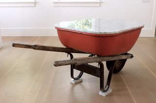 The American Ad Hoc series is a collection of classic American products with a Carrara marble top. <span style="line-height: 1.8;">By adding the table top, the products' utilitarian uses are reimagined as tables for the home. </span><span style="line-height: 1.8;">The tables are made from a wheelbarrow, a Weber grill and a Radio Flyer wagon. </span>
