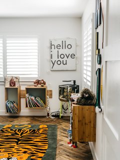 In an easy-going home in Los Angeles, a set of differently shaped wood shelves float on the walls, defying gravity and keeping the floor clean and open. The rustic wood means that they pop off the all-white walls with white window shades, and their distinct proportions give them an artful appearance.