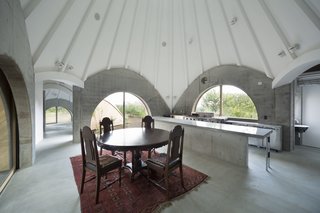 The kitchen features a stainless steel table for preparing food. 