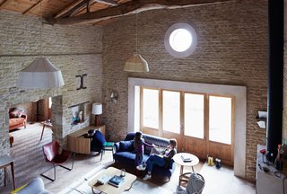 Over a Decade, Two Furniture Designers Reimagine a 300-Year-Old Barn - Photo 8 of 11 - Among the family’s favorite pieces is a 1957 leather Paulistano chair by Paulo Mendes da Rocha that Russell and Oona purchased to celebrate their marriage. "It’s important to us that the house is filled with beautiful things, but it has to be a place where it’s okay to put your feet on the sofa," Oona explains. 