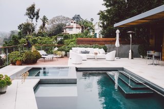 Interior designer Denise Kuriger used custom furniture to create a luxurious outdoor living space for this prefab Santa Monica home.