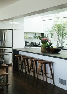 A renovation by Dimster Architecture transformed a Beachwood Canyon home by repurposing and converting multiple rooms, creating a more open, modern dwelling. 
