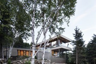 The south-facing facade looks out towards the forest. 