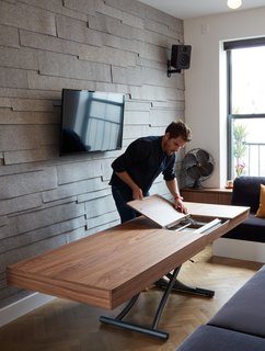 At His 350-Square-Foot Apartment, Small Space Champion Graham Hill Practices What He Preaches - Photo 4 of 15 - "We wanted something less Euro. We used felt on one wall, herringbone floors,and walnut shelving to give it some color," Graham Hill says.