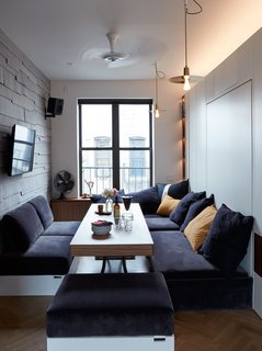 At His 350-Square-Foot Apartment, Small Space Champion Graham Hill Practices What He Preaches - Photo 5 of 15 - The Drop Hat pendants are by Plumen and the convertible sofa is by Resource Furniture. 
