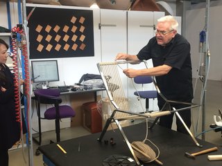 The PK25 by Poul Kjærholm was first produced in 1951. Made from a single piece of steel, the back and seat are wrapped in flag rope. 