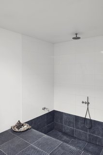 The recessed bath and shower makes the space feel like a private spa. 