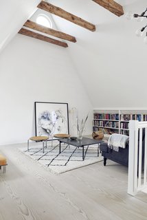 The children's bedrooms and living room are on the second floor. Two PK31 stools sit around a PK61 coffee table. 