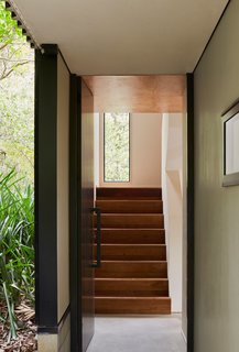 The walls meet the ceiling at unexpected angles, making the volumes appear larger than they are.