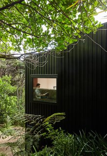 The mezzanine’s double-hung Altherm window looksout on mature kohekohe and taraire trees.