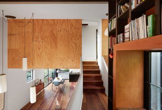 The living room’s retro lounge suite sits beneath a Fijian hardwood accent.