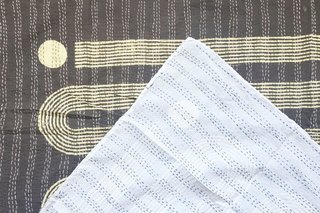 Each quilt is hand-stitched by a cooperative of women in rural Rajasthan. It takes two months to make each piece, and no two are exactly alike.