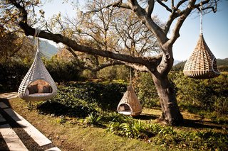 Dedon’s Hanging Lounger, designed by Daniel Pouzet and Fred Frety can be an instant mini-tree house escape. All you need is the right tree to hang it from. 