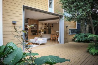 Floor-to-ceiling aluminum doors slide into the walls, bringing the outside world in and doubling the size of the living room. "It converted the space into something truly extraordinary, surrounded by vegetation. The climate in Mexico is perfect for it," says Nina. 
