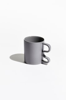 Rather than the conventional half circle, each mug is held by a sharp, squiggly, or abstract handle. 