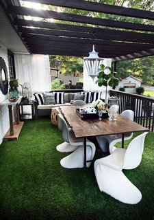 Drought or desert-scaping doesn't have to feature only succulents. For rooftop spaces, high-quality astroturf is low maintenance and a great grass replacement.