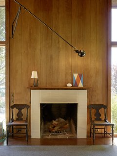 "At night, we have lots of lamps around, but the wood interior absorbs most of the light so the mood and soul of the house turn into this glowing, amber lantern up on the hill." -Charles de Lisle