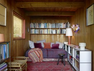 One of the bedrooms is filled with various rich textures and patterns.