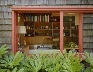 "The tiny kitchen is most often crammed with cooking and a bar. Somehow, we can have three or four of us moving about in there and it all works." -Charles de Lisle