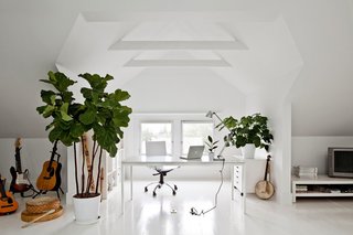 In this Portland attic, Jessica Helgerson Interior Design whitewashed the entire space and added a pair of windows to lighten up the formerly dim space. 