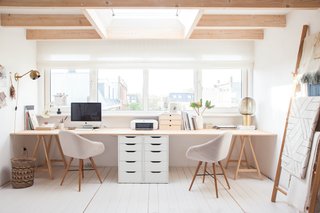 A lifestyle blogger and designer calls this top attic her top floor flat, and also acts as a studio for photography, branding, and textile design. 