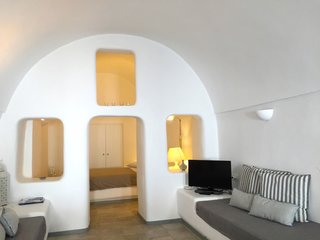 Ever Wanted to Stay in a Cave That’s Actually Pretty Modern Inside? - Photo 1 of 10 - Located in the small village of Katerados, Il Melograno is a spacious two-bedroom yposkafo—a traditional Santorini-style cave house—with white-washed walls and a private sunlit courtyard.