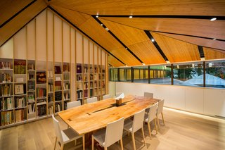 The collection of Japanese garden and cultural books is housed in the Vollum library. A custom-made George Nakashima table sits in the foreground. 