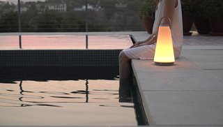 Designed for both indoors and outdoors, this portable lamp by Pablo Studio works as both a speaker and a light that features bluetooth connectivity, full-range dimming control, and a touch-sensitive volume control.