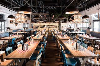 Located in a former goods shed, Munich Brauhaus can hold 900 guests, many of which can gather in the main dining space that’s filled with long communal tables—a brauhaus necessity.