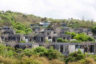 Located close to some of the island's best surfing beaches, a golf course, and the Uluwatu Temple, Alila Villas Uluwatu was designed by architecture firm WOHA, and features a Sunset Cabana Lounge that appears to hang off a cliff over the Indian Ocean. 
