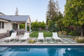 Designed by Arterra Landscape Architects for a pair of gastronomists and their children, this garden sits on the property of a traditional home, but boasts a modern landscape where the children can roam free among fruits, herbs, and vegetables. 